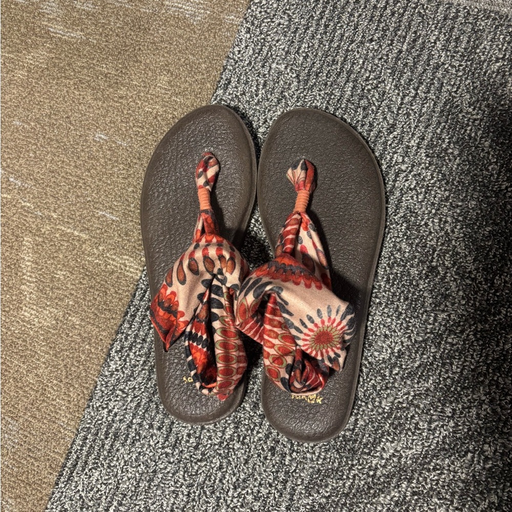 Sanuk Brown Flip Flops with Red Patterned Straps